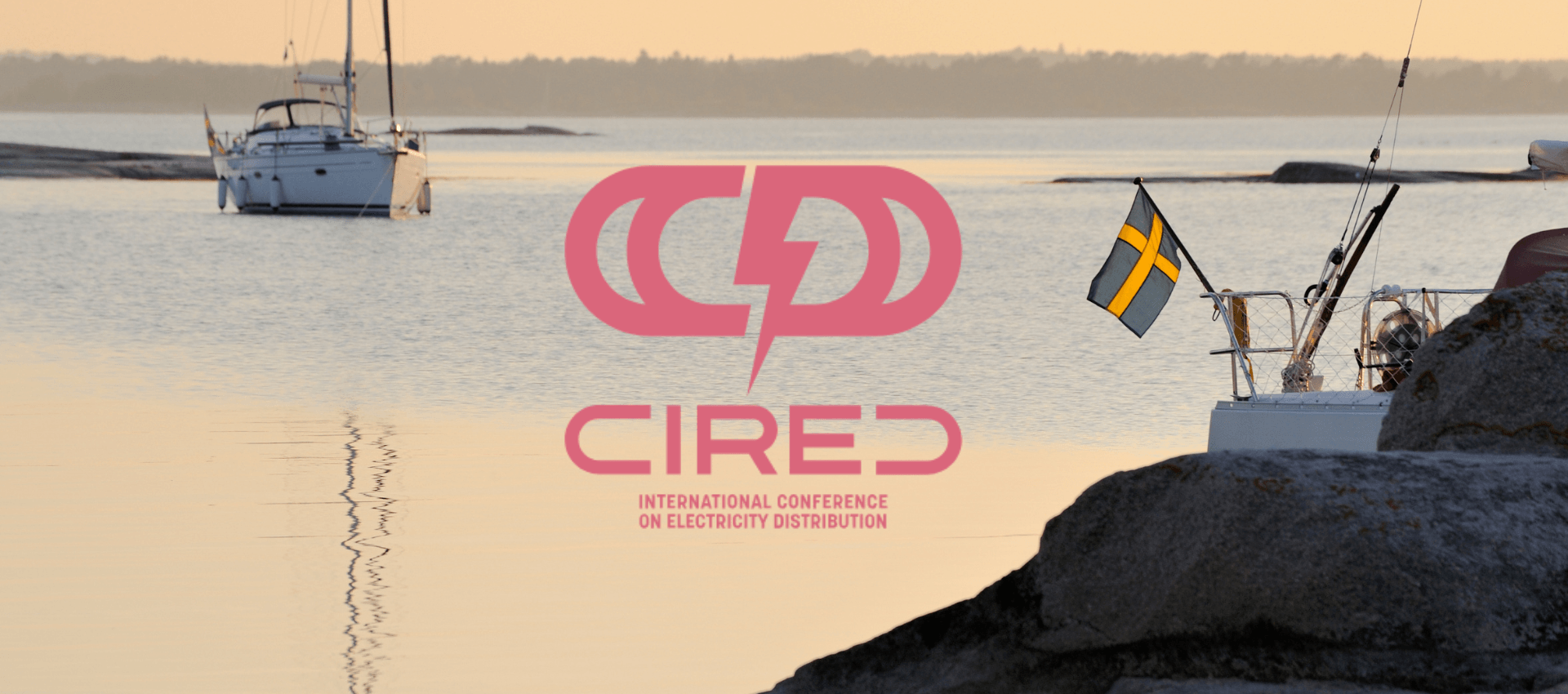 CIRED conference logo over serene archipelago with sailboats and Swedish flag.